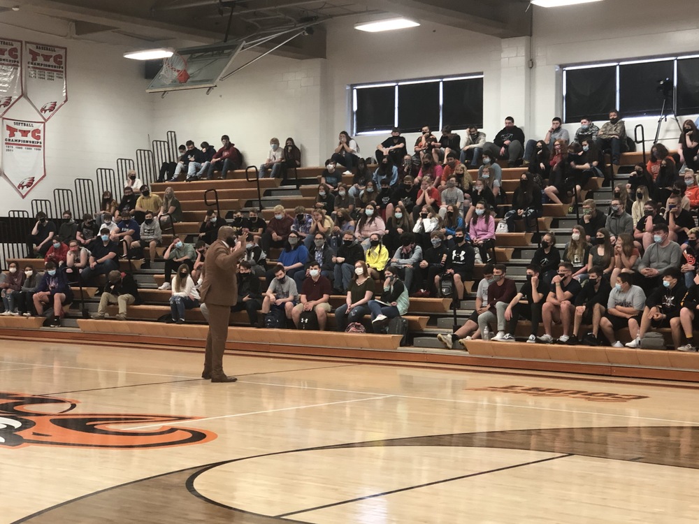coach speaking at assembly 