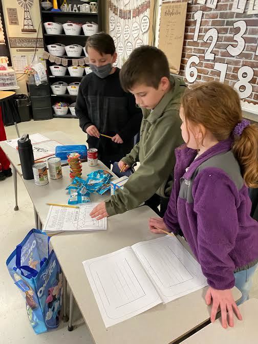 Third grade student practice graphing with groceries!
