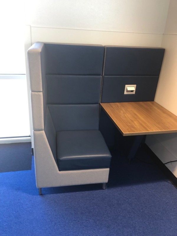 small cubby with table and plug in for electronics