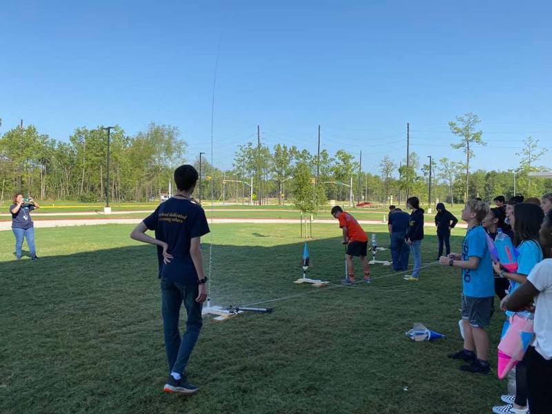 8th grade students test their rocket designs